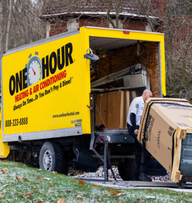 Photo of employee loading a work truck